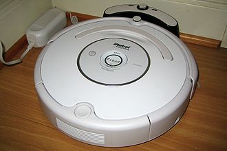 A Roomba 530 on its charge station.
